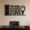 The Door Is Closed The Brain Is Open removable vinyl wall decal shown on a smooth home office wall