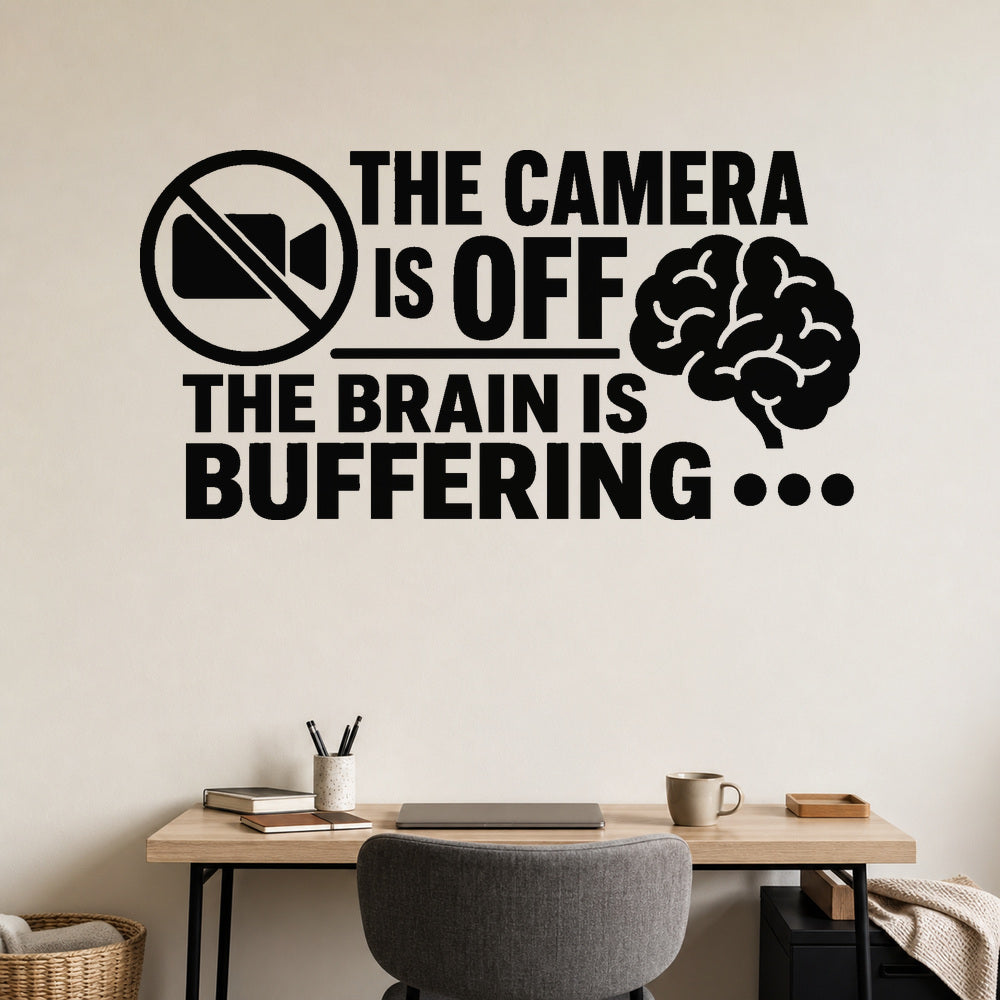 The Camera Is Off The Brain Is Buffering removable vinyl wall decal shown on a smooth home office wall