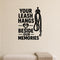 Your Leash Hangs Beside Our Memories removable vinyl wall decal shown on a smooth interior wall