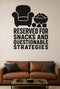 Reserved for Snacks and Questionable Strategies black vinyl wall decal shown applied to a smooth interior wall