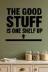 Alternate room view of the The Good Stuff Is One Shelf Up removable vinyl wall decal.