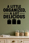 A Little Organized, a Lot Delicious - Pantry Wall Decal removable vinyl wall decal shown on a smooth interior wall