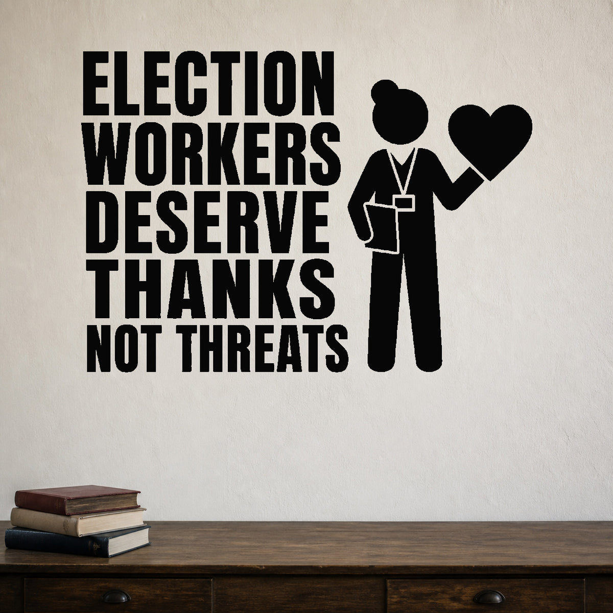 Election Workers Deserve Thanks Not Threats removable vinyl wall decal shown in a styled room.