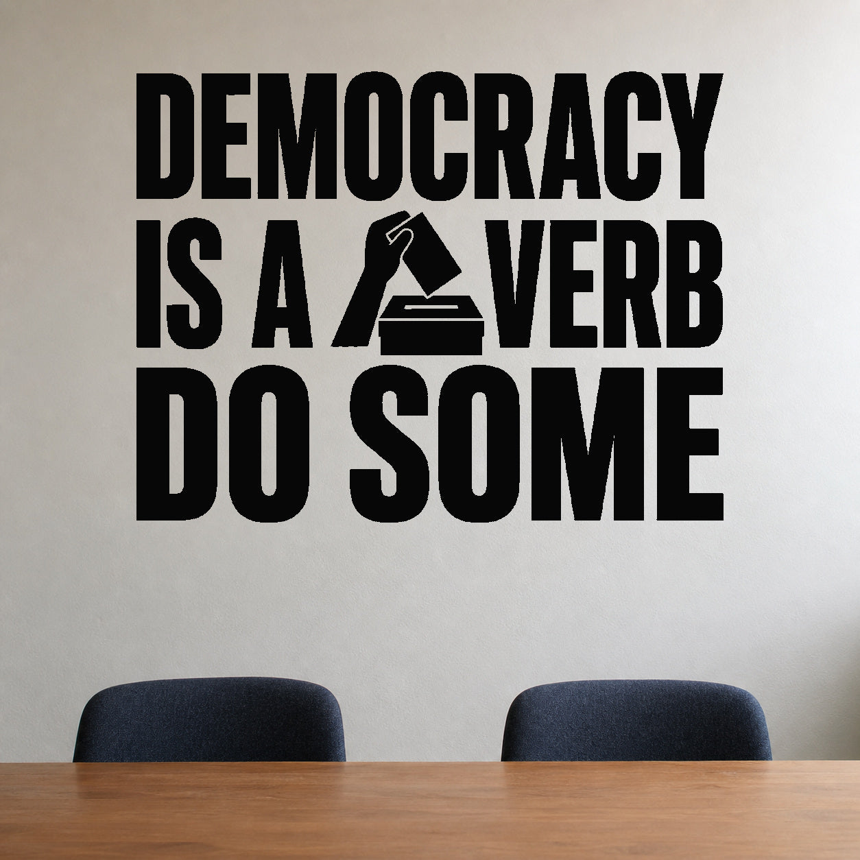 Democracy Is a Verb Do Some removable vinyl wall decal shown in a styled room.