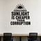 Sunlight Is Cheaper Than Corruption removable vinyl wall decal shown in a styled room.