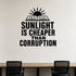 Sunlight Is Cheaper Than Corruption removable vinyl wall decal shown in a styled room.