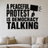 A Peaceful Protest Is Democracy Talking - Democracy Rights Wall Decal removable vinyl wall decal shown on a smooth interior wall