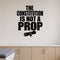 The Constitution Is Not a Prop - Political Satire Wall Decal removable vinyl wall decal shown on a smooth interior wall