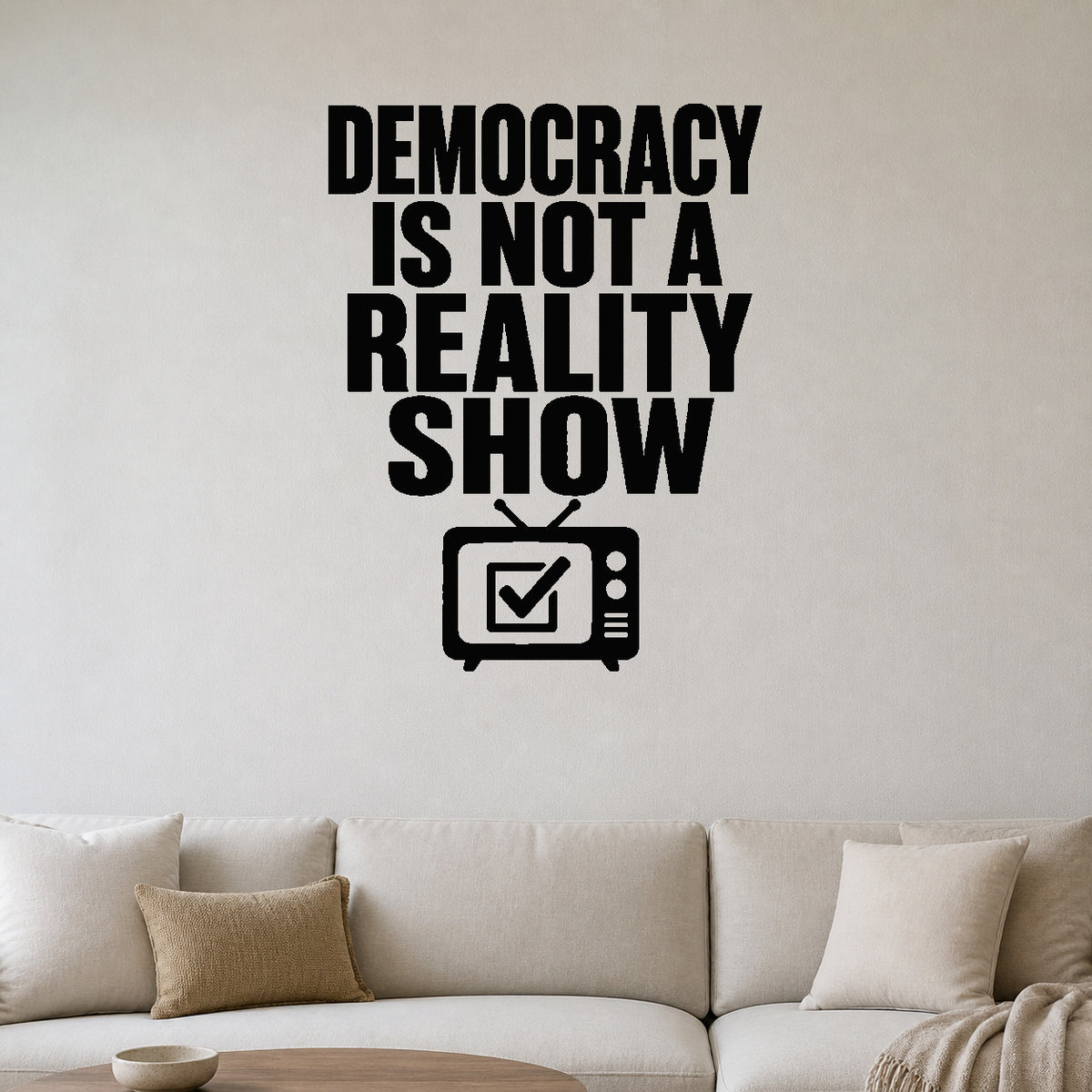 Democracy Is Not a Reality Show removable vinyl wall decal shown in a styled room.