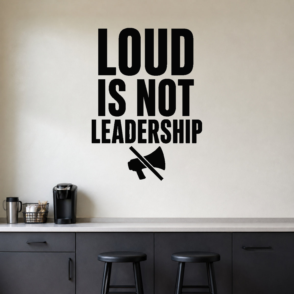 Loud Is Not Leadership removable vinyl wall decal shown in a styled room.