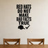 Red Hats Do Not Make Bad Facts True removable vinyl wall decal shown in a styled room.