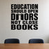 Education Should Open Doors Not Close Books removable vinyl wall decal shown in a styled room.