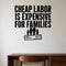 Cheap Labor Is Expensive for Families removable vinyl wall decal shown in a styled room.