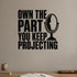 Own the Part You Keep Projecting removable vinyl wall decal shown in a styled room.