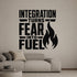 Integration Turns Fear Into Fuel removable vinyl wall decal shown in a styled room.