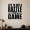 Life Is Not a Battle It Is a Game removable vinyl wall decal shown in a styled room.