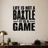 Life Is Not a Battle It Is a Game removable vinyl wall decal shown in a styled room.