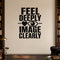 Feel Deeply Image Clearly removable vinyl wall decal shown in a styled room.