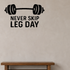Never Skip Leg Day - Fitness Sports Wall Decal Vinyl Sticker Removable shown as a removable vinyl wall decal in a category-appropriate room