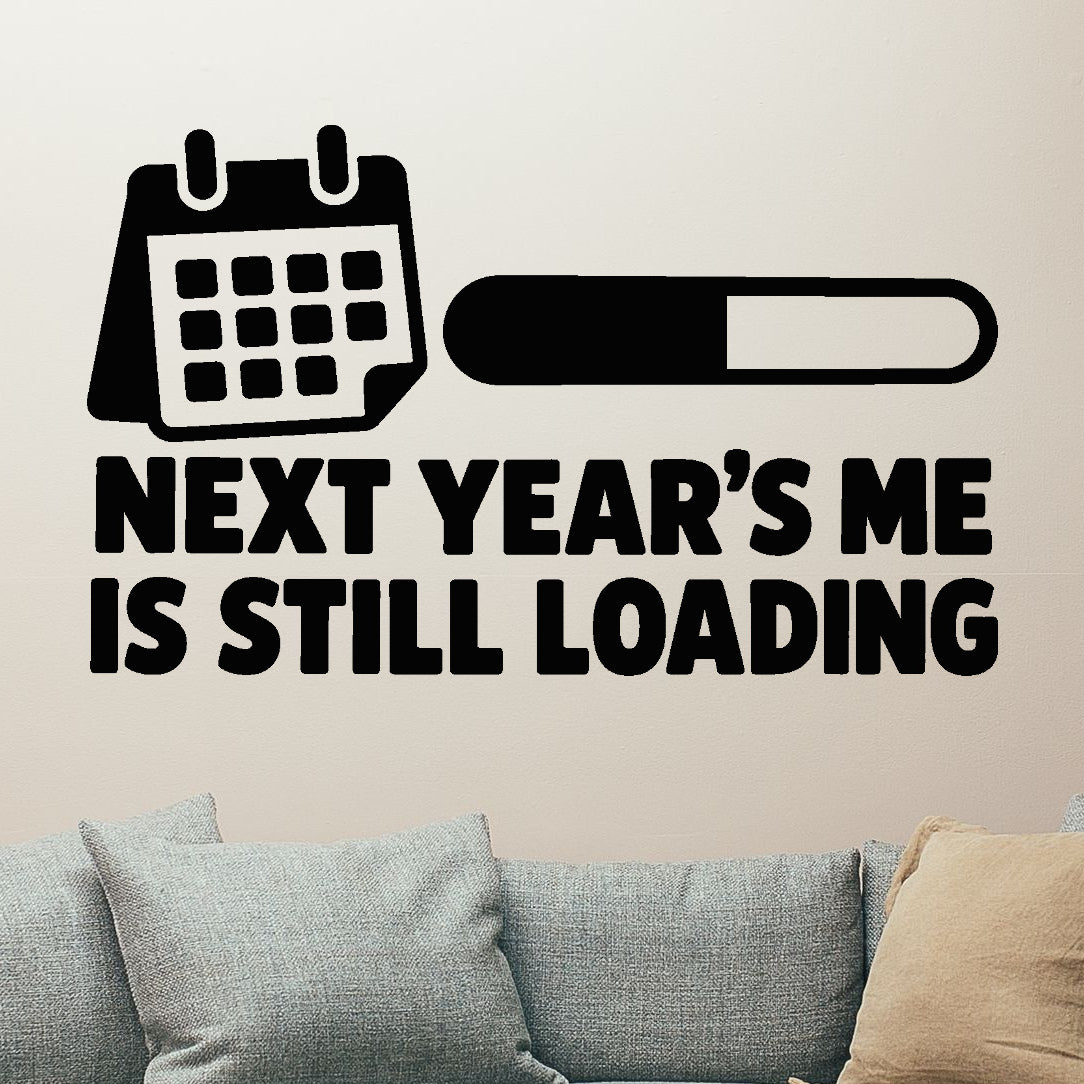 Next Year's Me Is Still Loading Removable Wall Decal shown on a clear indoor wall