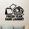 Fresh Year, Same Laundry Removable Wall Decal shown on a clear indoor wall