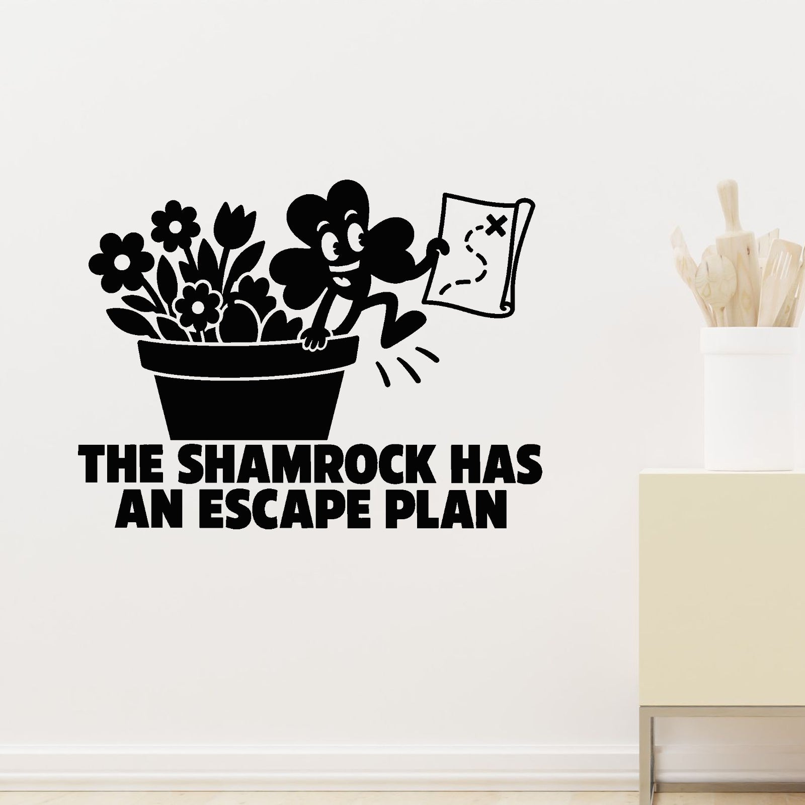 The Shamrock Has An Escape Plan Removable Wall Decal shown on a clear indoor wall