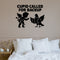 Cupid Called For Backup Removable Wall Decal shown on a clear indoor wall