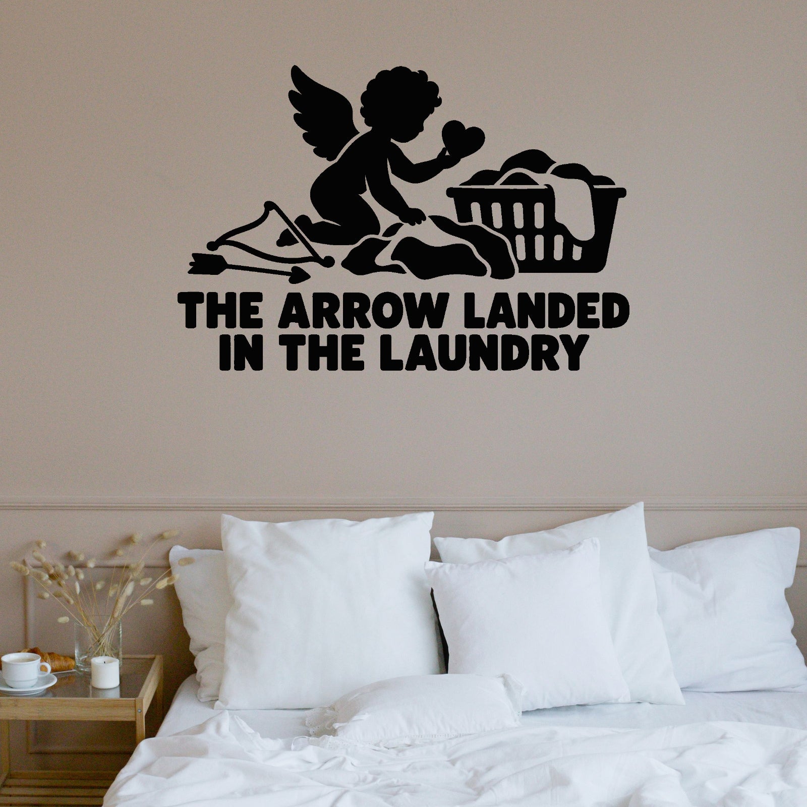 The Arrow Landed In The Laundry Removable Wall Decal shown on a clear indoor wall