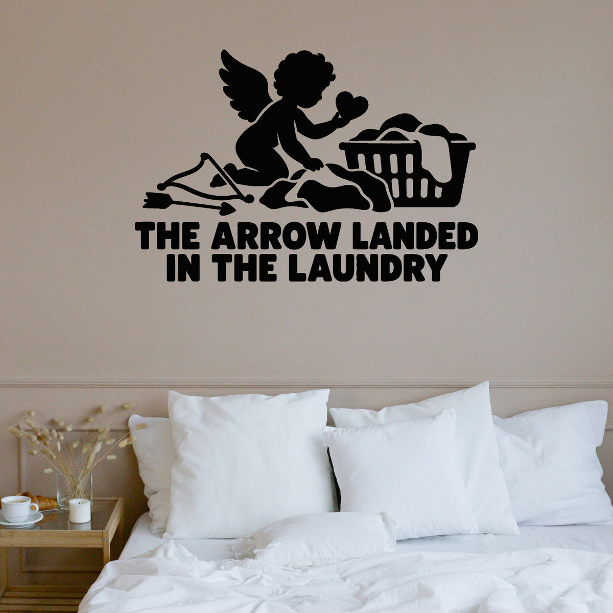 The Arrow Landed In The Laundry Removable Wall Decal shown on a clear indoor wall