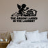 The Arrow Landed In The Laundry Removable Wall Decal shown on a clear indoor wall