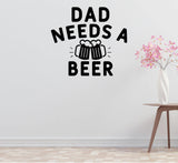a wall with a humorous text that reads "DAD NEEDS A BEER" accompanied by a graphic of two beer mugs. There is also a small table with a vase of pink flowers in the background.