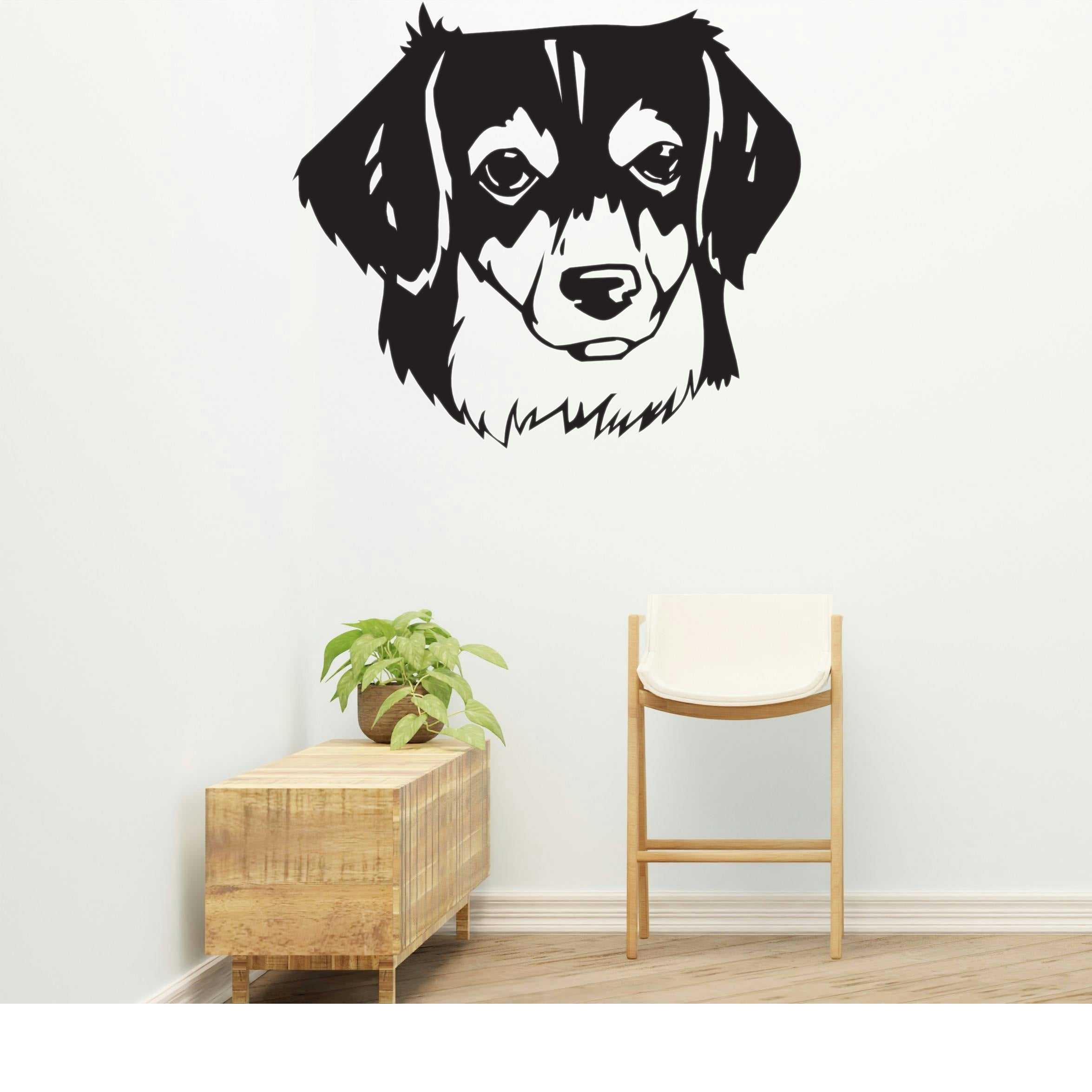 a black and white dog's face on a wall