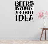 a wall with a bold, black and white text quote that reads "BEER IS ALWAYS A GOOD IDEA". Below the quote, there is a graphic of a beer mug. To the right of the quote, there is a small table with a vase of pink flowers on it.