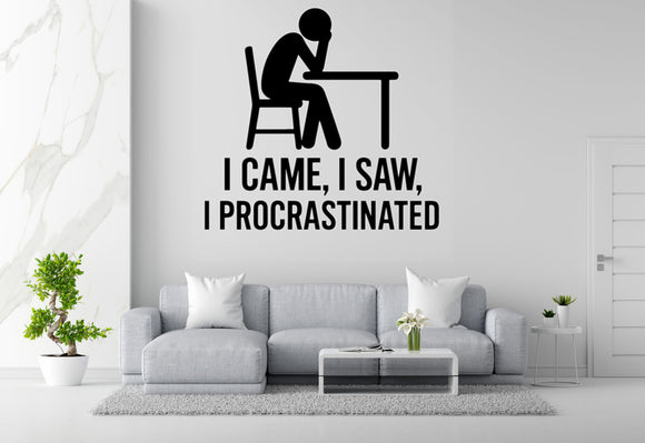 a wall decal with a simple black silhouette of a person sitting at a desk, accompanied by the text 