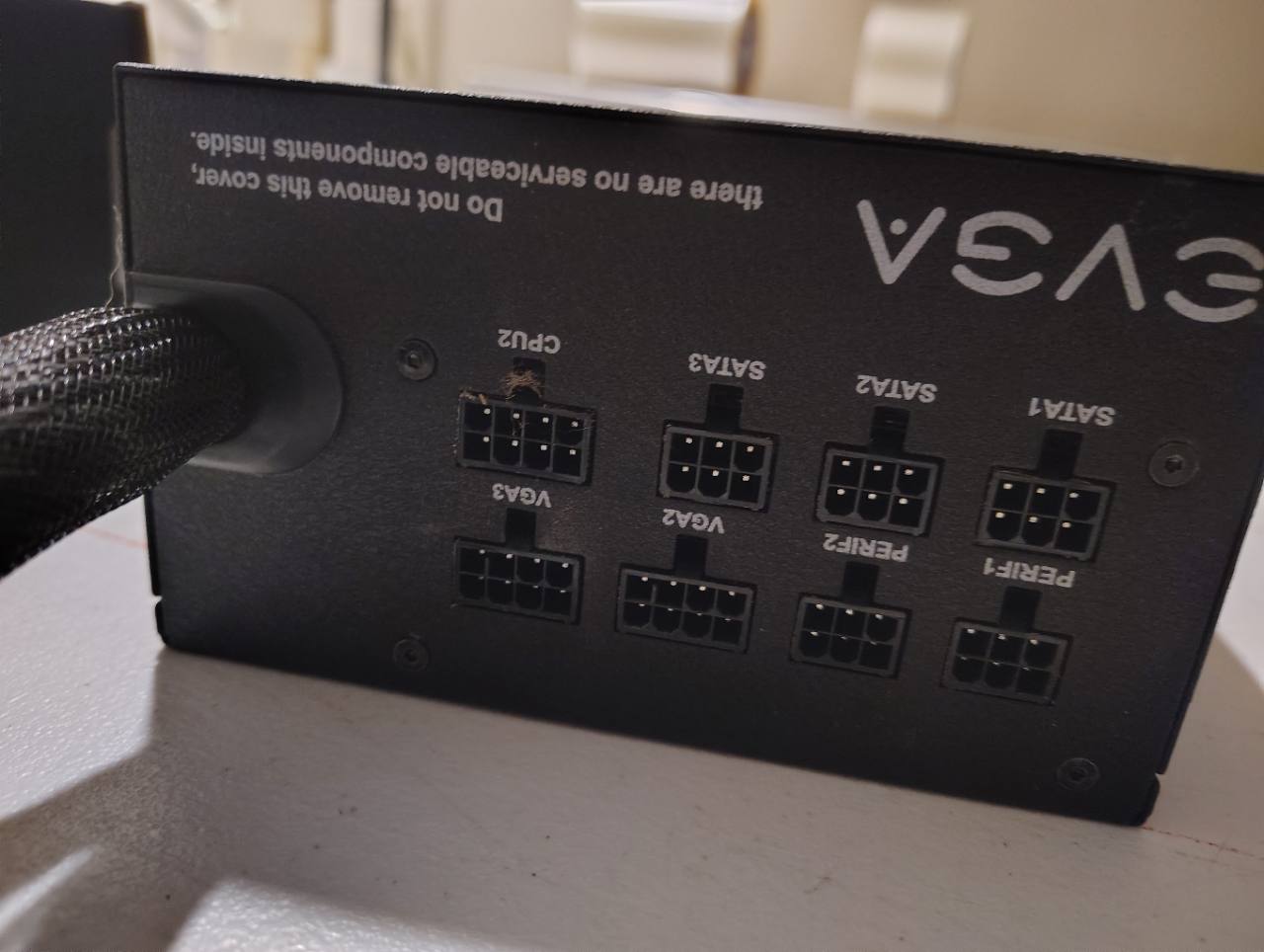 Actual EVGA power supply modular connector panel, showing cosmetic wear