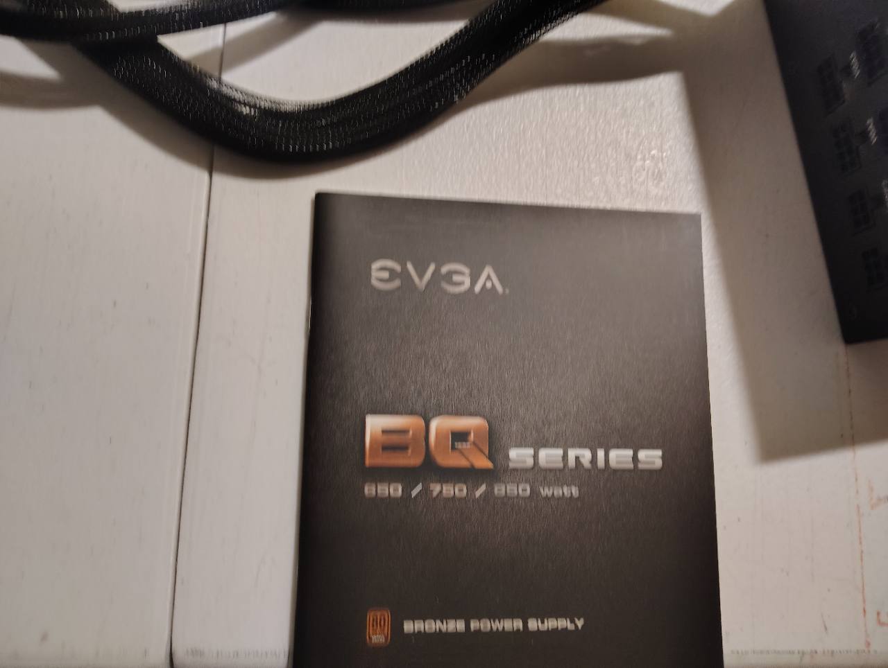 Pictured EVGA BQ series instruction manual; inclusion pending confirmation
